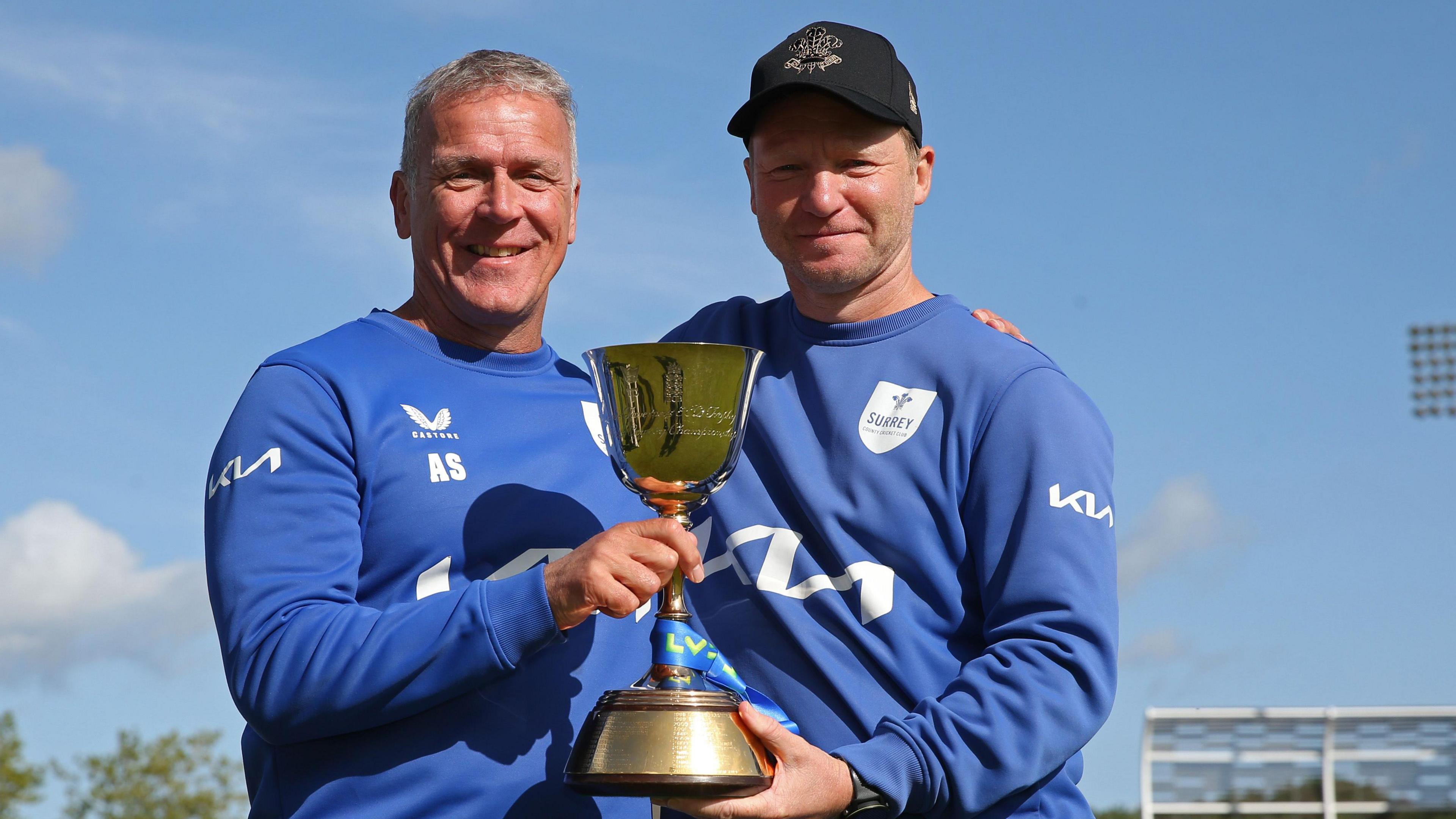 Surrey Director of Cricket, Alec Stewart and Surrey Head Coach, Gareth Batty pose with the County Championship Division One trophy 