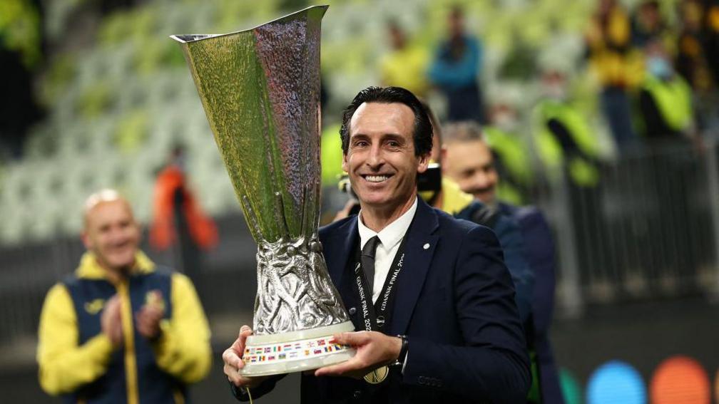 Unai Emery holds the Europa League trophy following Villarreal's victory over Manchester United in the final in Gdansk