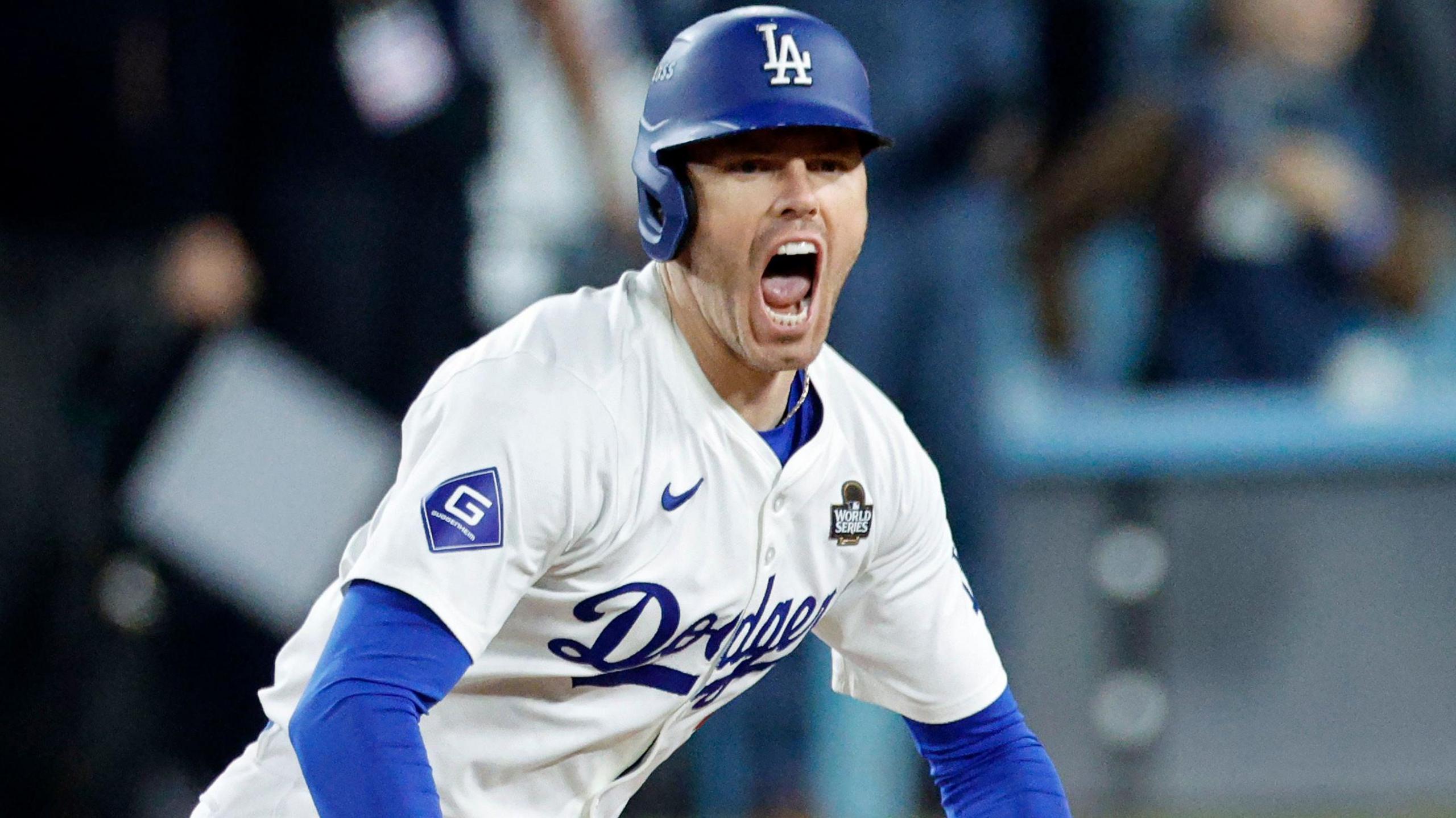 Los Angeles Dodgers first baseman Freddie Freeman celebrates after hitting a walk-off grand slam to win game one of the World Series