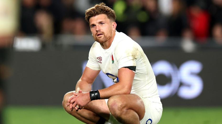 Henry Slade kneeling in England kit