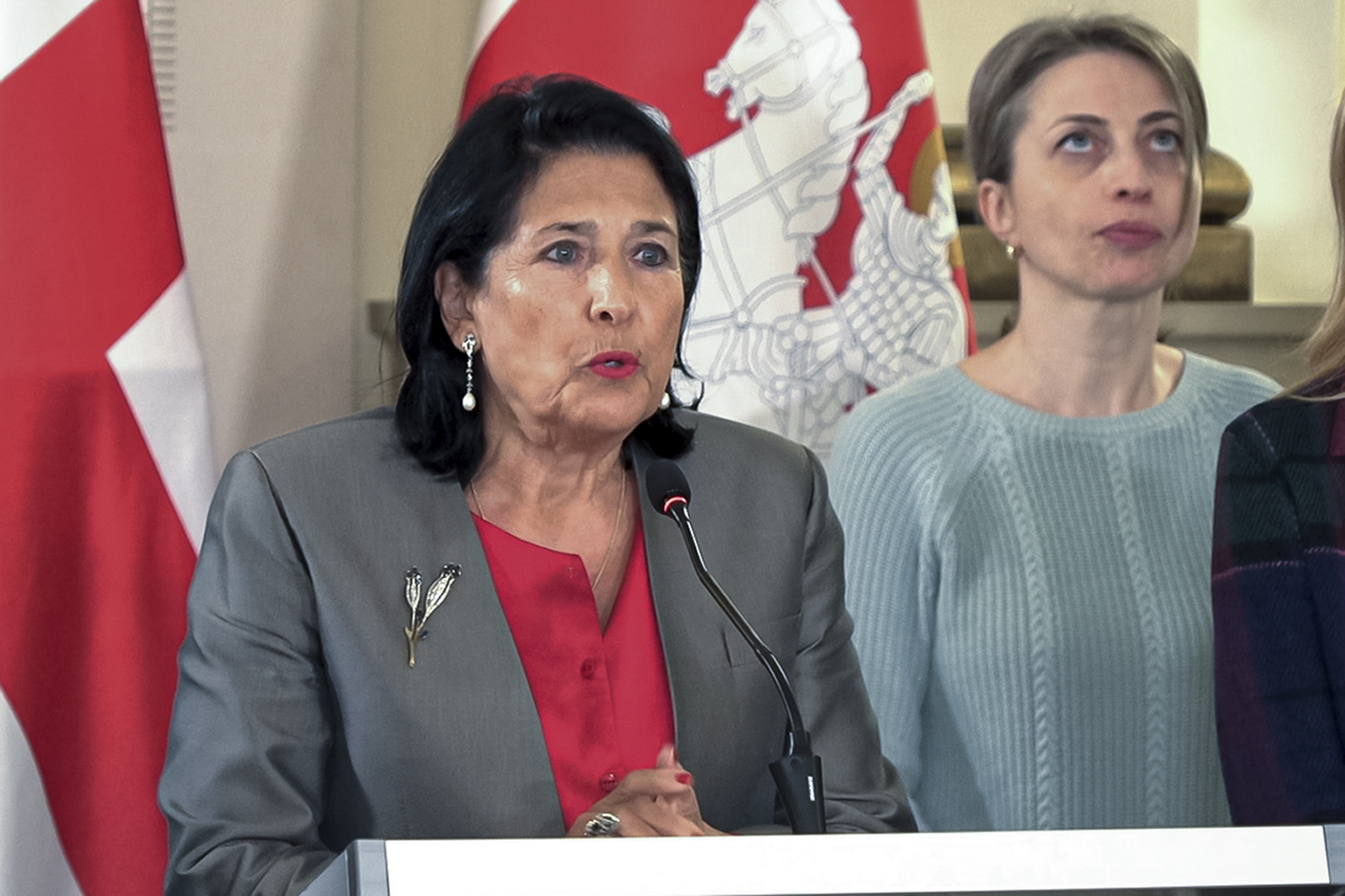 In this photo taken from video, Georgian President Salome Zourabichvili, left, speaks to the media as Nana Malashkhia, who leads the Coalition for Change parliament list, right, stands near, after the parliamentary election in Tbilisi, Georgia, on Sunday, Oct. 27, 2024. (AP Photo/Kostya Manenkov)