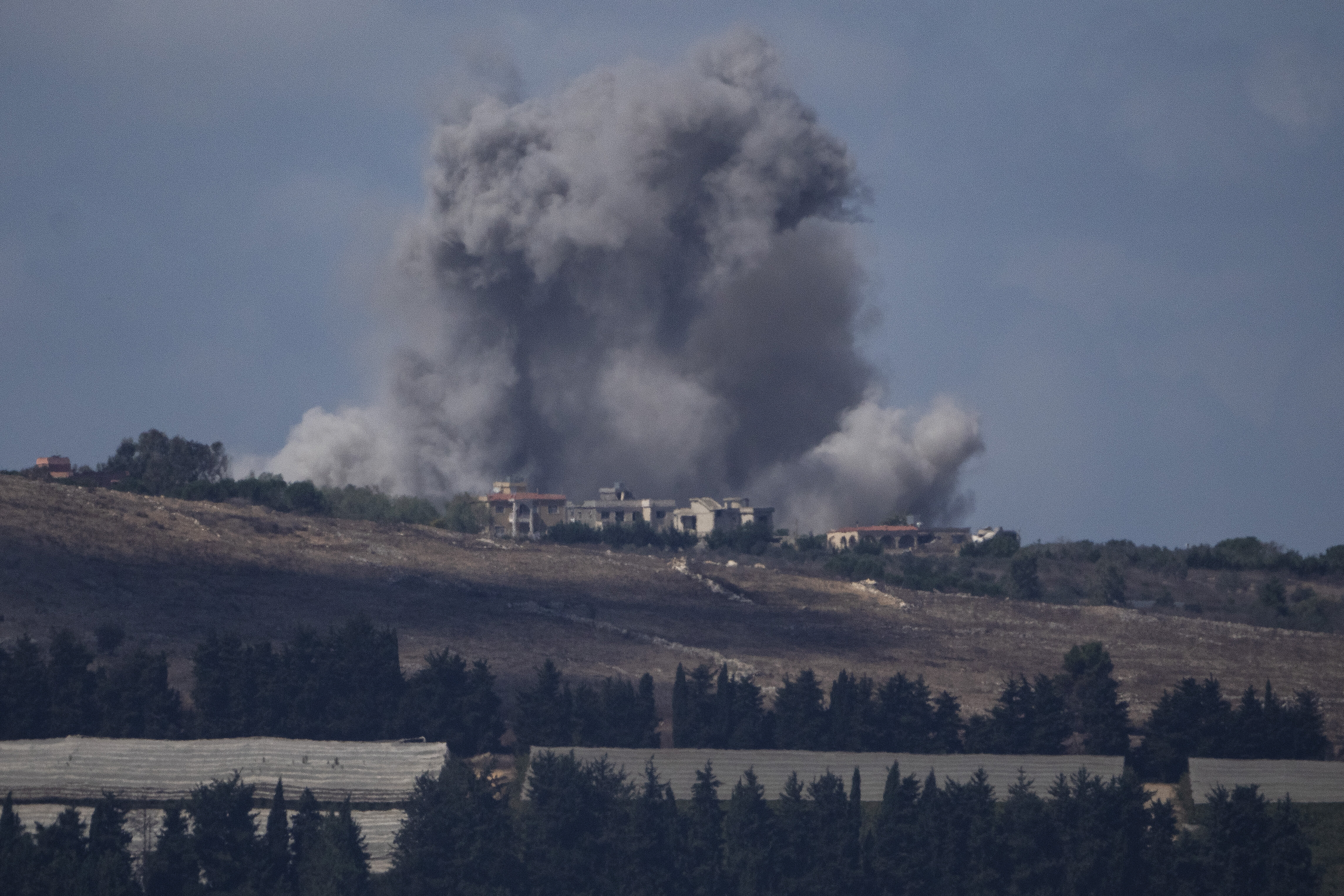 An Israeli airstrike hits an area in southern Lebanon as seen from northern Israel, Wednesday, Oct. 2, 2024. (AP Photo/Leo Correa)