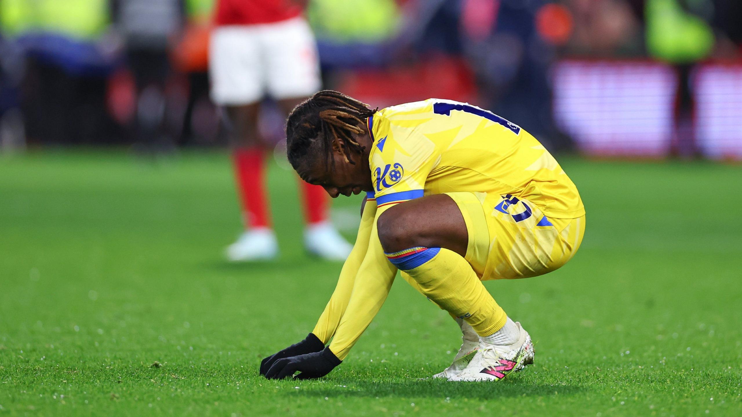 Eberechi Eze touches the pitch