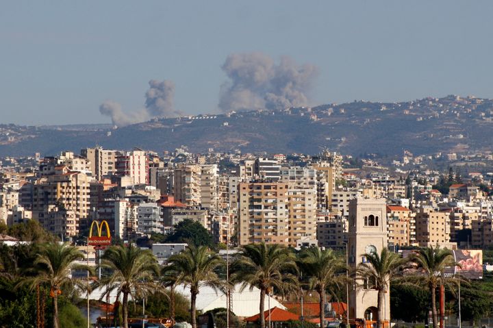 Smoke rises during Israeli strikes on villages overlooking the souther Lebanese city of Tyre on October 11, 2024. (Photo by KAWNAT HAJU/AFP via Getty Images)