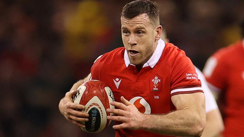 Gareth Davies attacks for Wales in the 2024 Six Nations