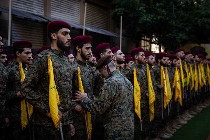 Hezbollah fighters line up to attention at the funeral of the Radwan Forces commander Ibrahim Aqil and commander Mahmoud Hamad, both killed in an Israeli airstrike on a residential building in the Dahiyeh suburb of Beirut, Lebanon.