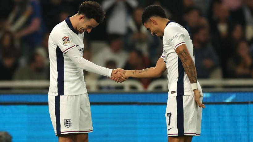 Curtis Jones (left) thanks Morgan Gibbs-White for the assist after the Liverpool midfield man's brilliant goal