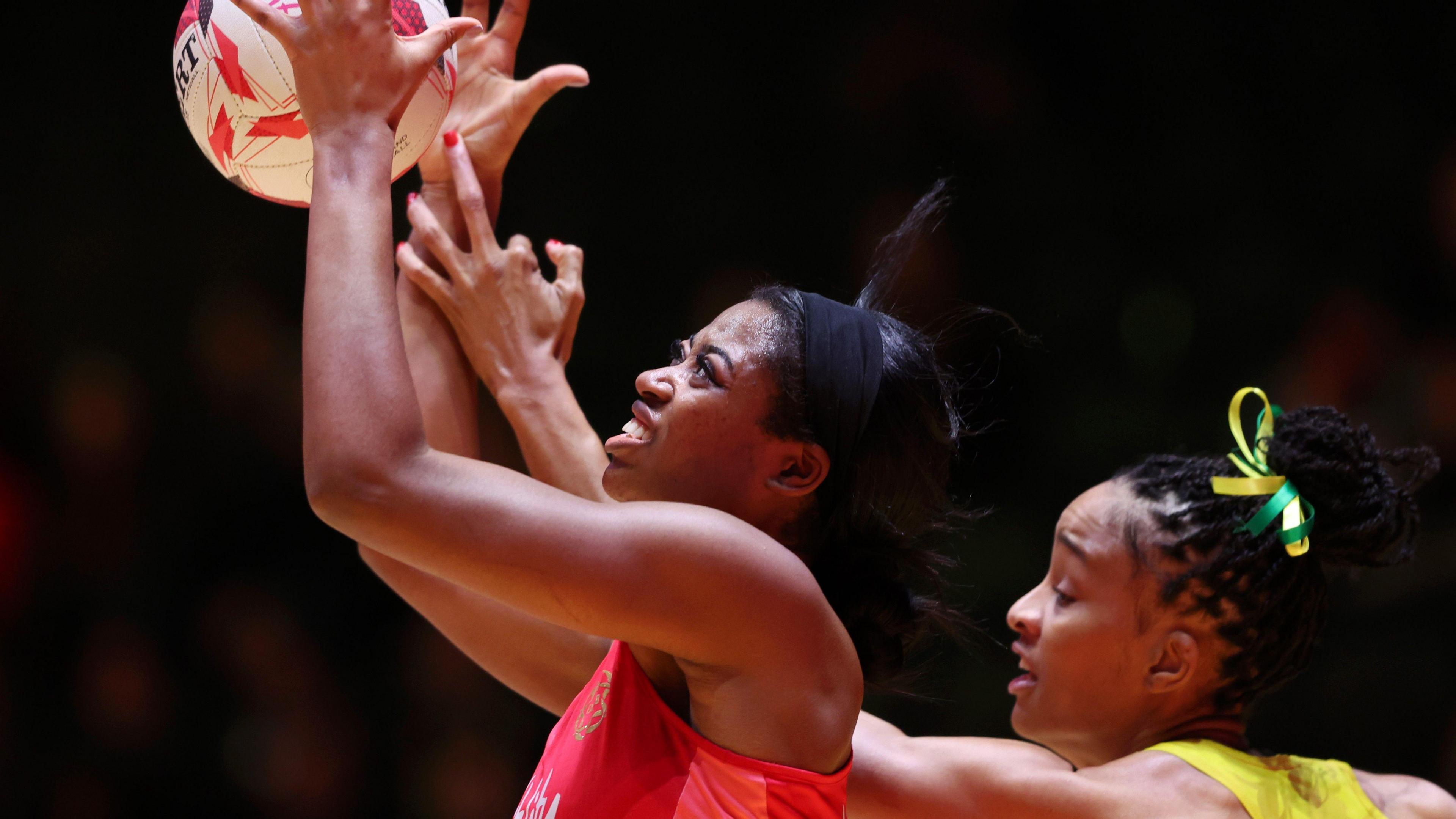 England Liv Tchine and Jamaica's Shamera Sterling Humphrey go for the ball