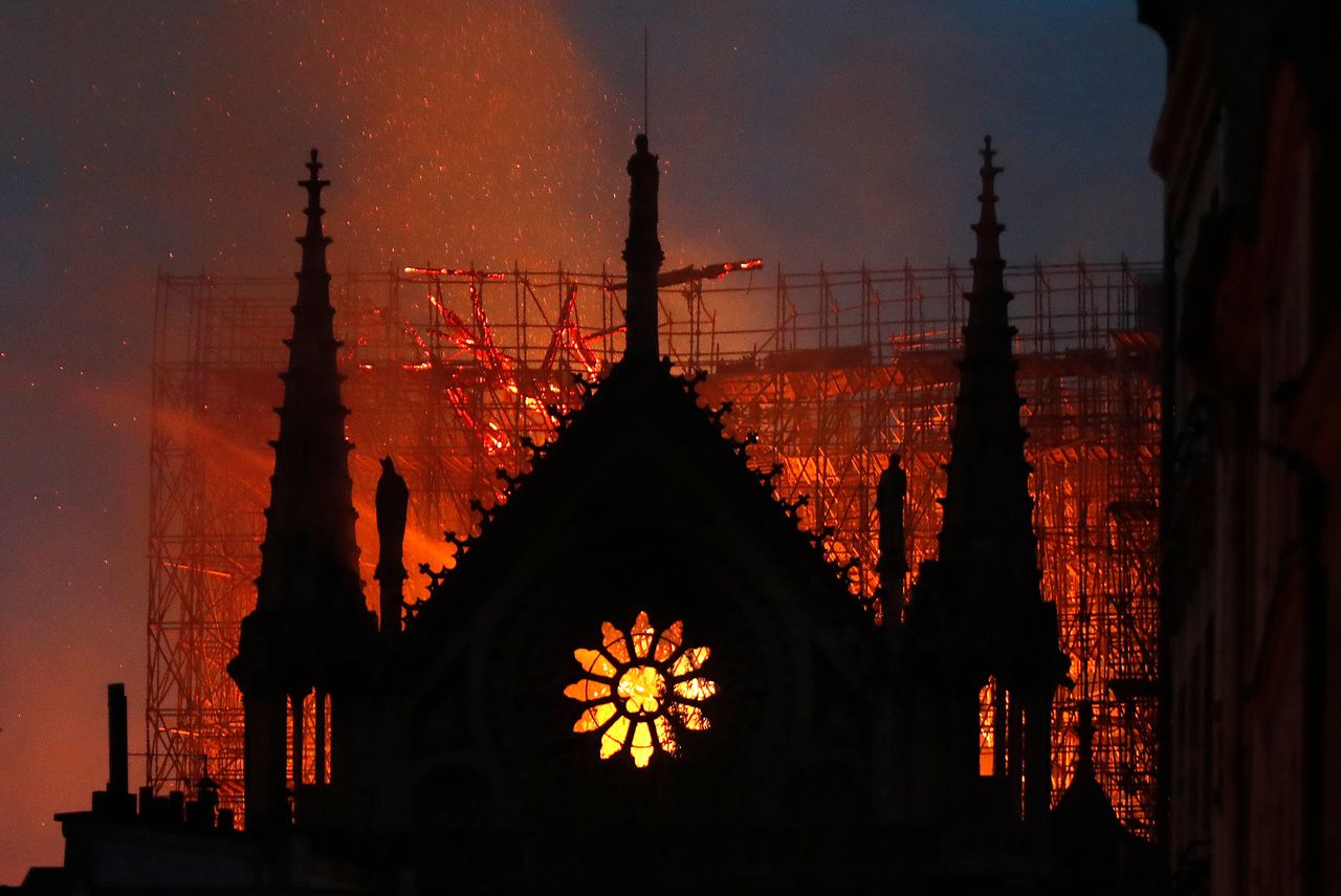 Flames and smoke rise from Notre Dame Cathedral as it burns on April 15, 2019 in Paris.