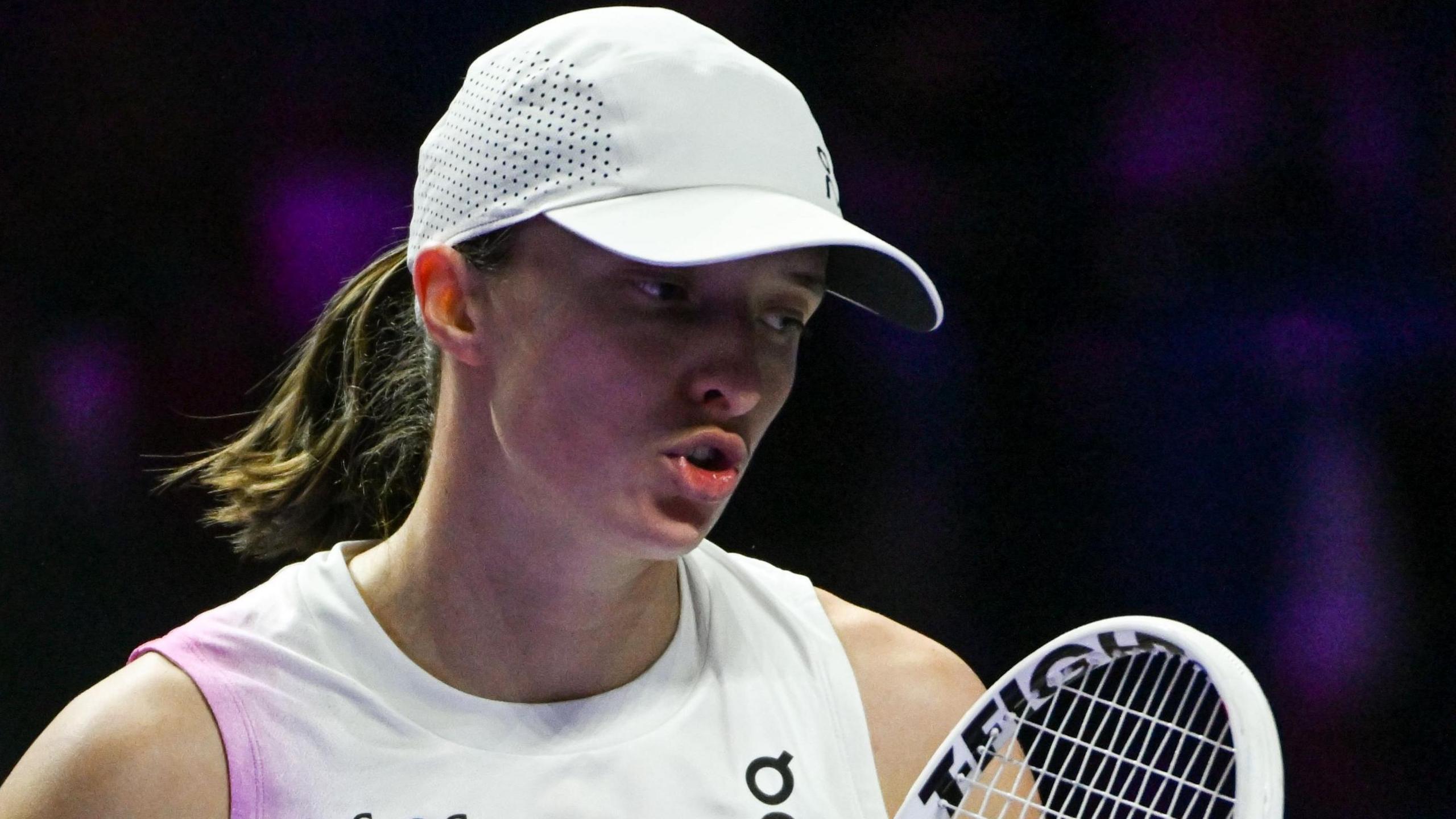 Iga Swiatek reacts during a match at the 2024 WTA Finals