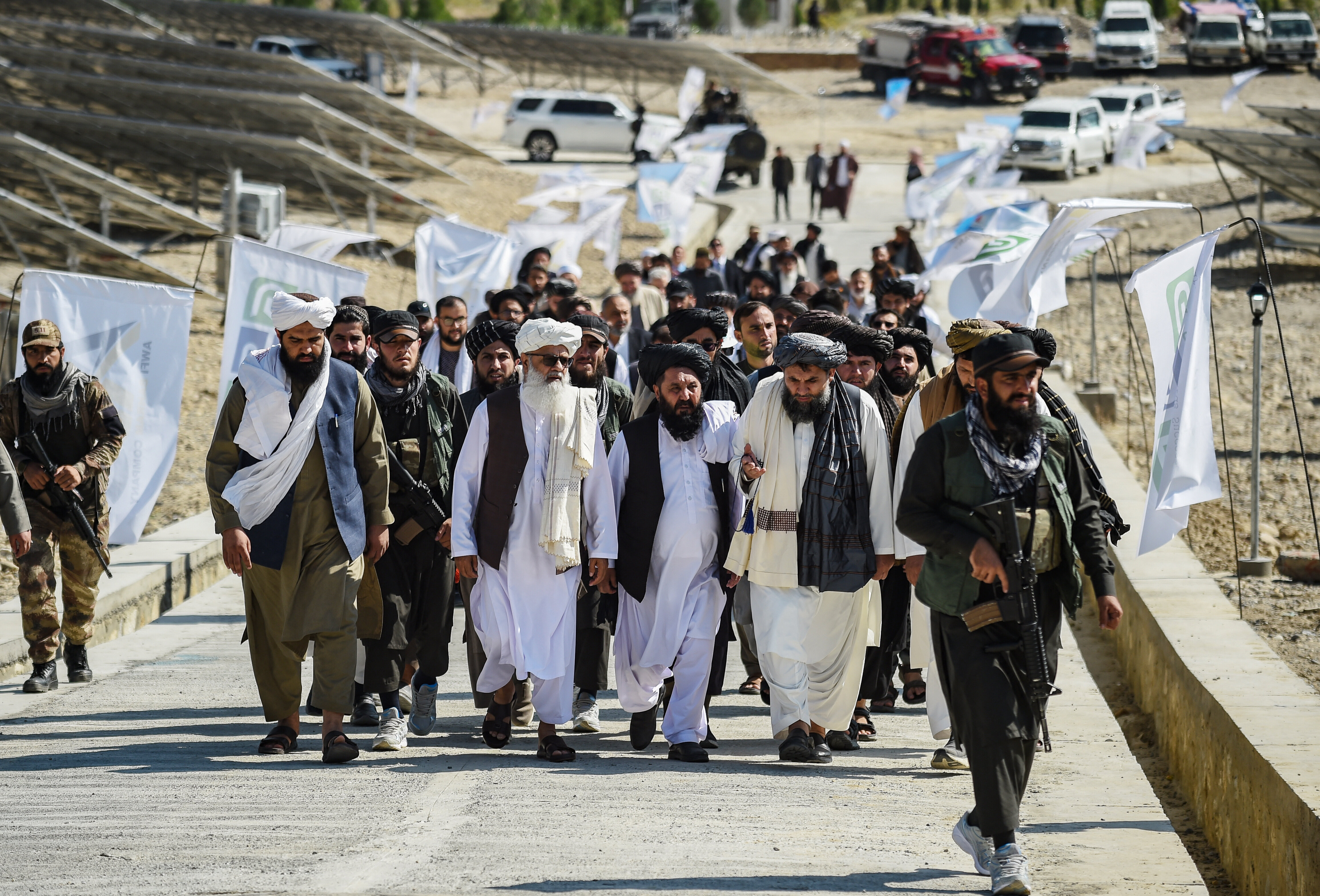 Taliban authorities arrive for the inauguration of a solar energy project in Naghlu in Surobi district of Kabul province on Oct. 19, 2024. 