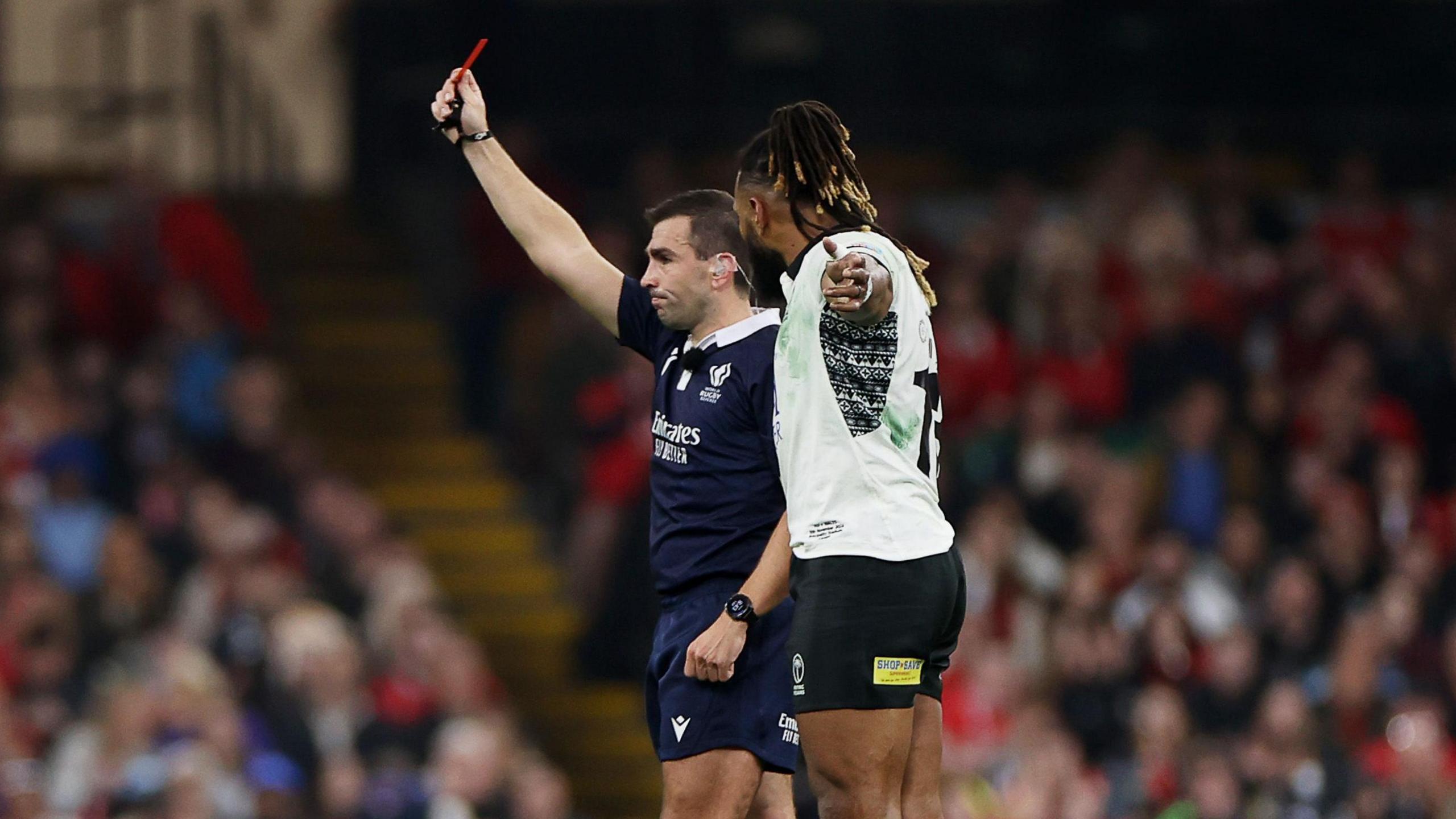 Referee Luc Ramos shows Radradra a red card