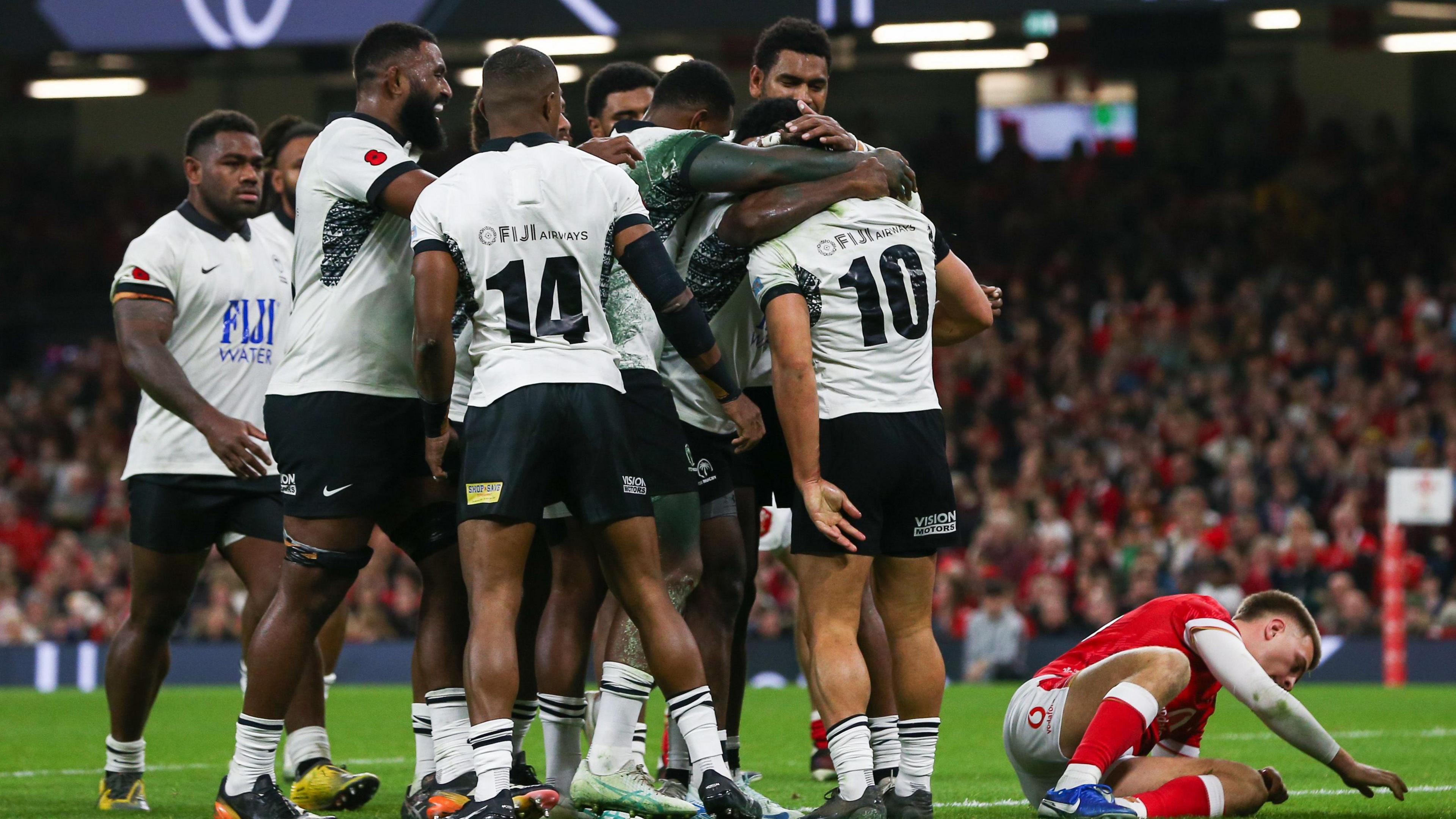 Fiji celebrate scoring a try against Wales