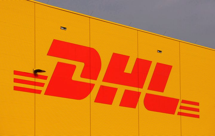 The logo of German fright company DHL is seen on a terminal at the airport Leipzig/Halle, Jan. 29, 2008. (AP Photo/Matthias Rietschel, File)