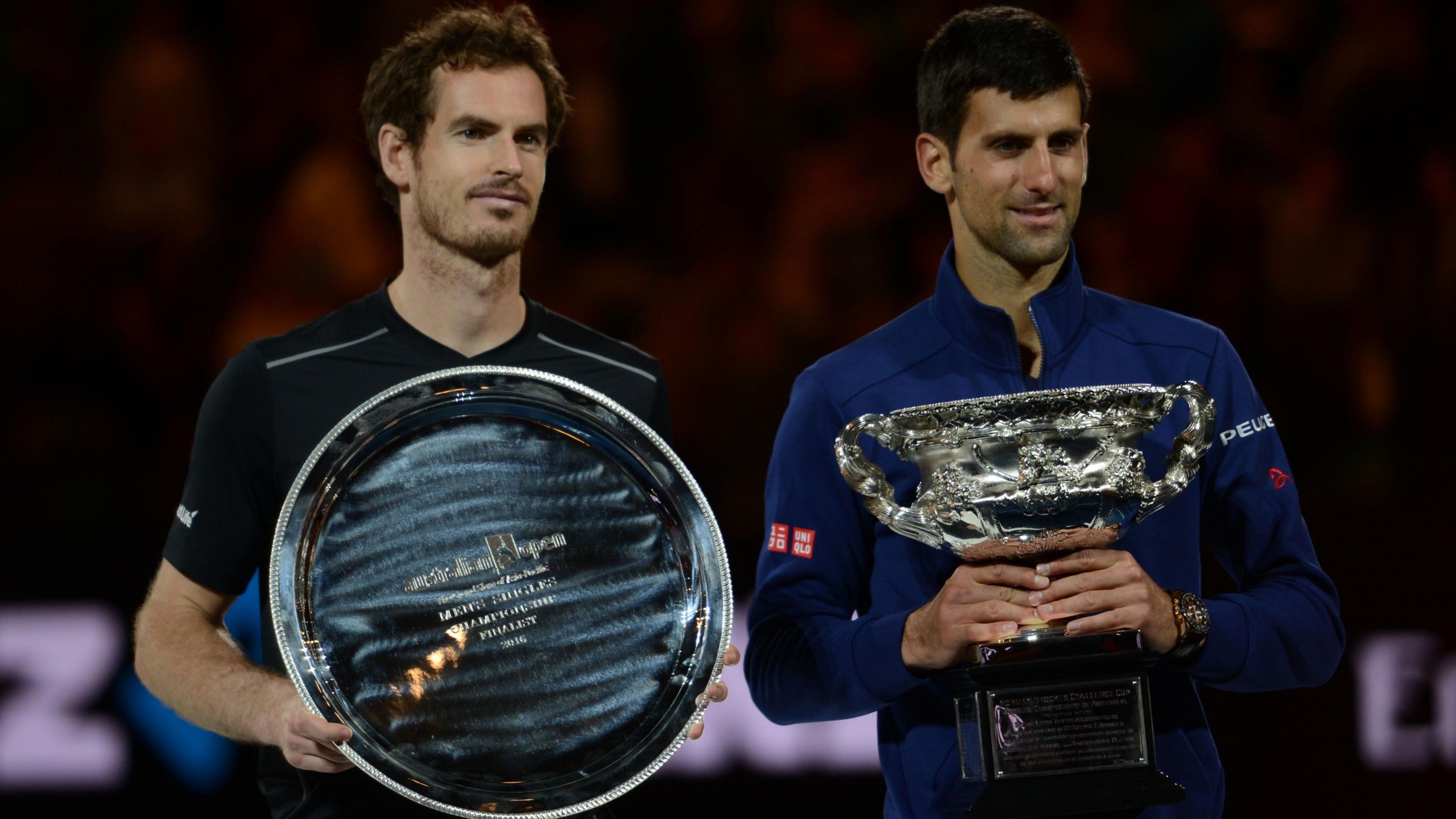 Andy Murray and Novak Djokovic with their respective trophies at the 2016 Australian Open