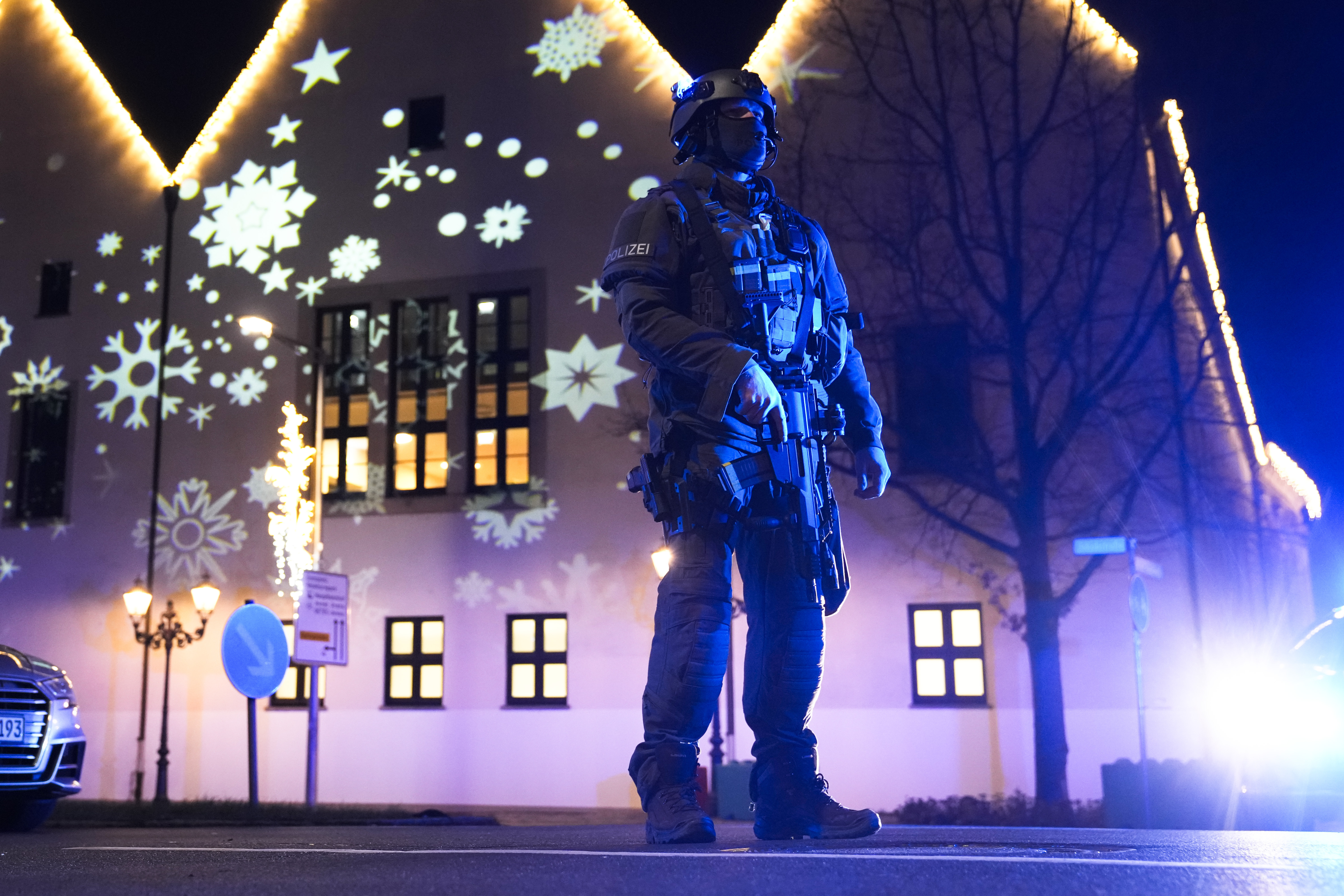 A police officer guards at a cordoned-off area near a Christmas Market after an incident in Magdeburg, Germany, Friday, Dec. 20, 2024. (AP Photo/Ebrahim Noroozi)