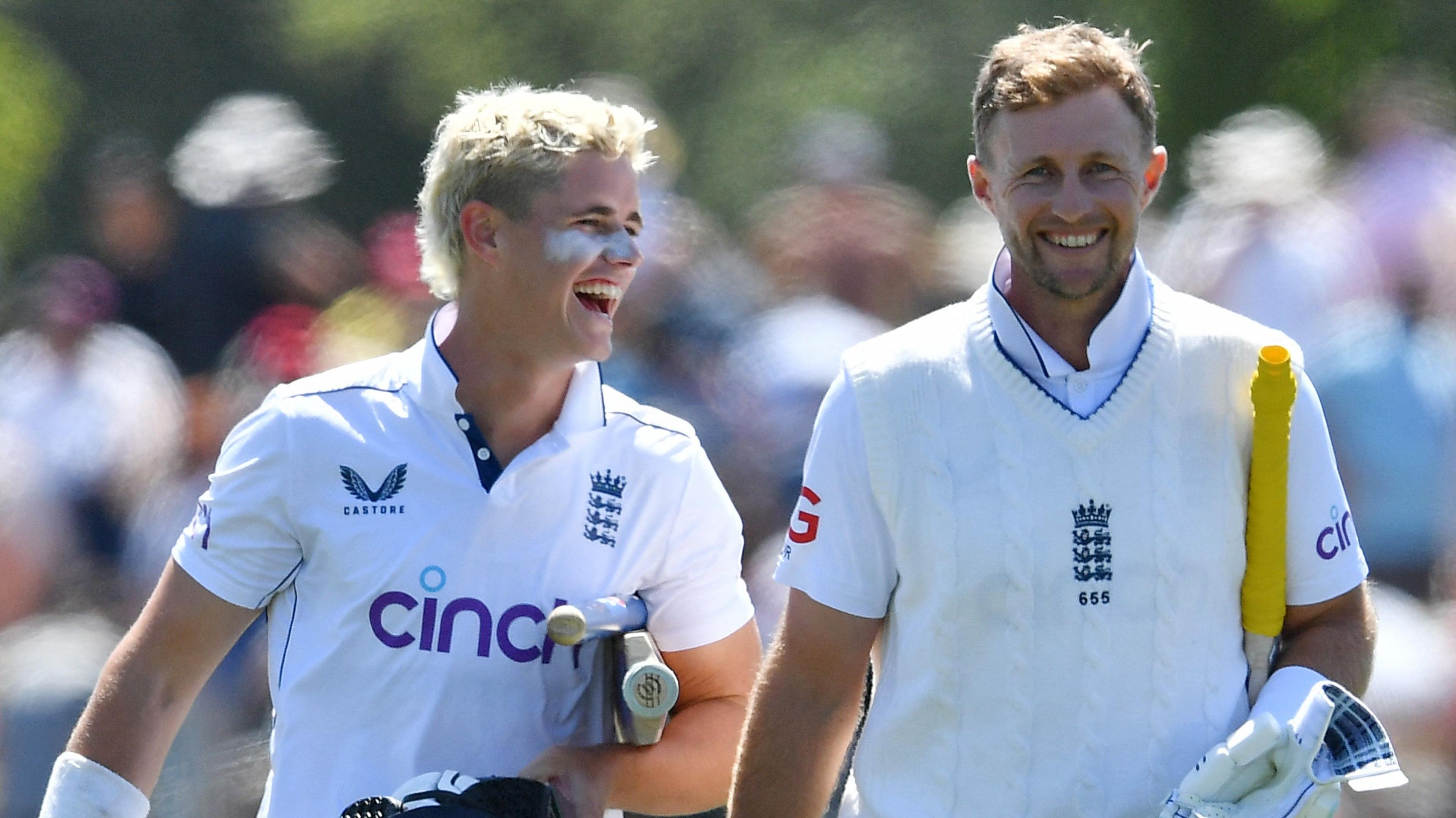 Jacob Bethell and Joe Root walk off smiling