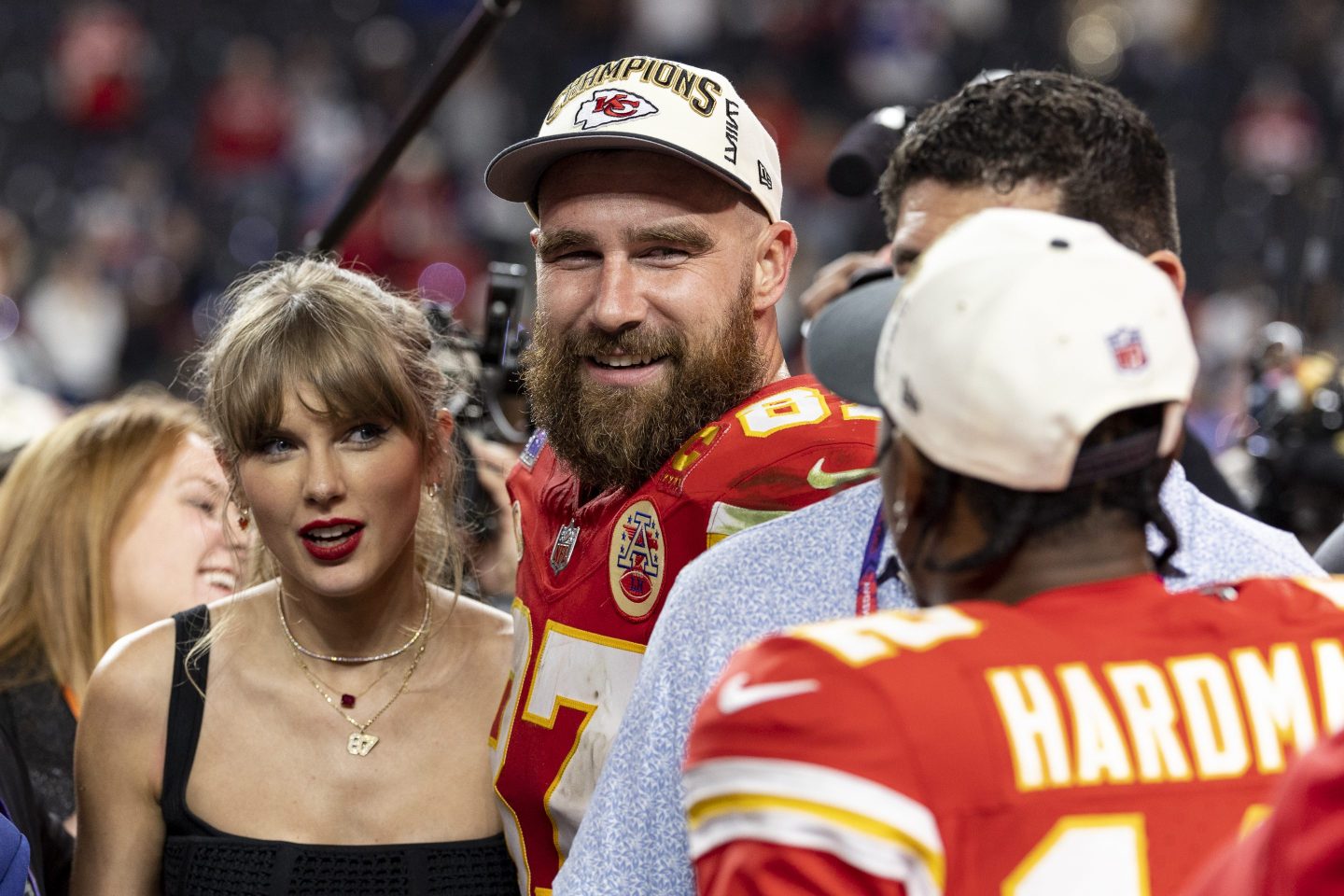 Travis Kelce #87 of the Kansas City Chiefs and Taylor Swift react as they see Mecole Hardman Jr. #12 of the Kansas City Chiefs following the NFL Super Bowl 58 football game between the San Francisco 49ers and the Kansas City Chiefs at Allegiant Stadium on February 11, 2024 in Las Vegas, Nevada.