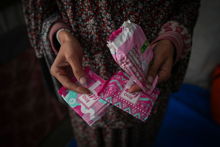 Wafaa Nasrallah shows sanitary pads at her tent in a camp for displaced Palestinians in Deir al-Balah, Gaza Strip, on Saturday, Dec. 28, 2024. The displaced mother of two says life in the camps makes even the simplest needs difficult, like getting period pads, which she can hardly afford.