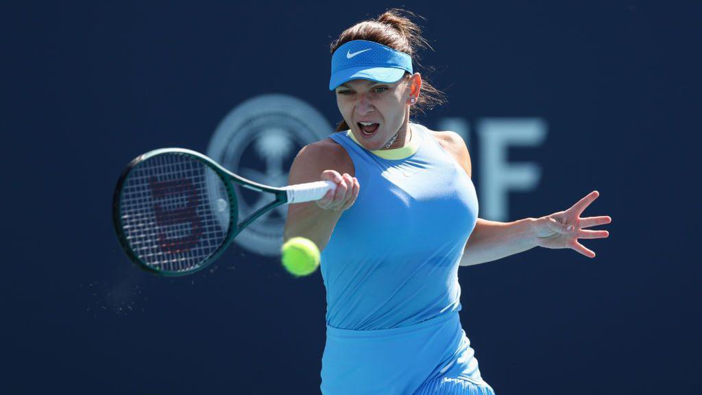 Simona Halep concentrates as she plays a forehand