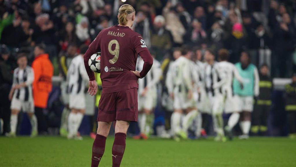 Erling Haaland looks on after Manchester City's loss to Juventus 