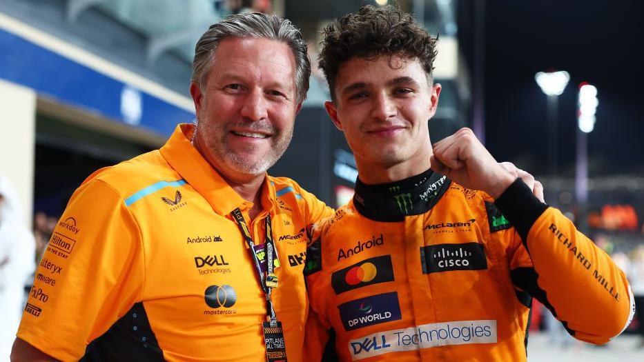 Lando Norris and McLaren CEO celebrate after winning the Abu Dhabi Grand Prix and the constructors' championship