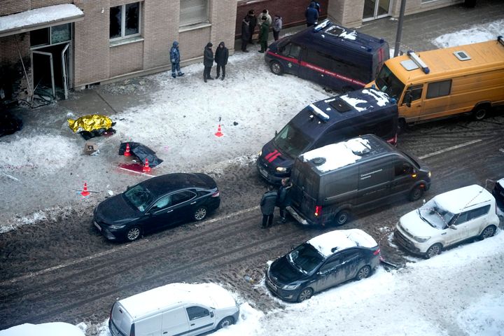 Investigators stand at the site where Lt. Gen. Igor Kirillov, the head of Russia's Nuclear, Biological, and Chemical Defense Forces, and his assistant, Ilya Polikarpov, were killed by an explosive device planted close to a residential apartment's block in Moscow, Russia, on Dec. 17, 2024. 