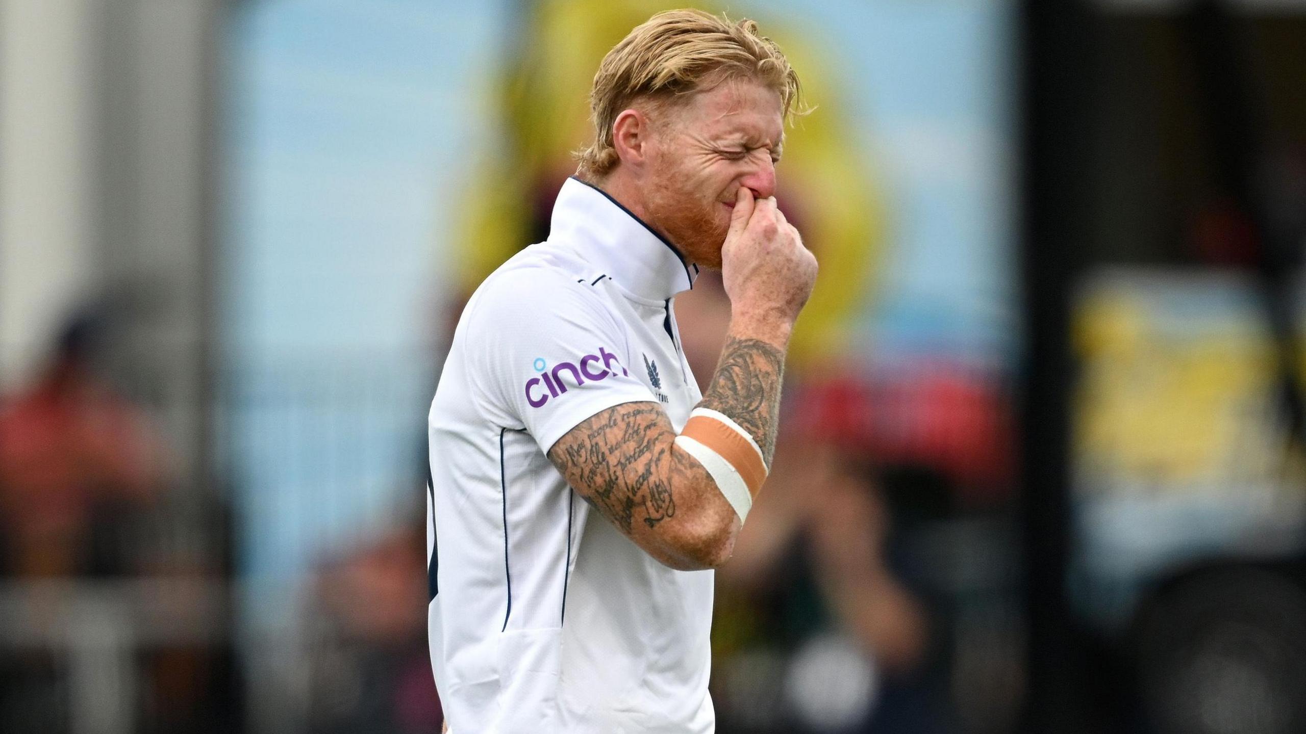 England captain Ben Stokes winces as he leaves the field injured