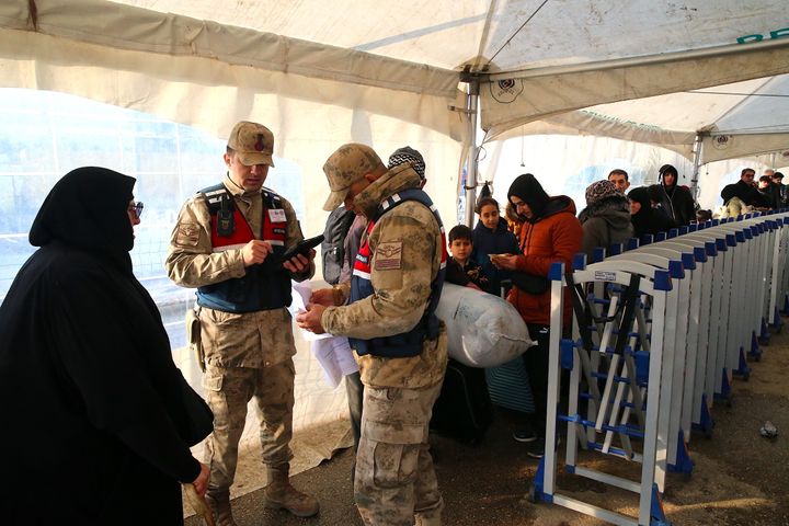 Syrians who have completed customs cross into their country via the Cilvegozu Border Gate between Turkey and Syria, on Dec. 27, 2024 in Hatay, Turkey.