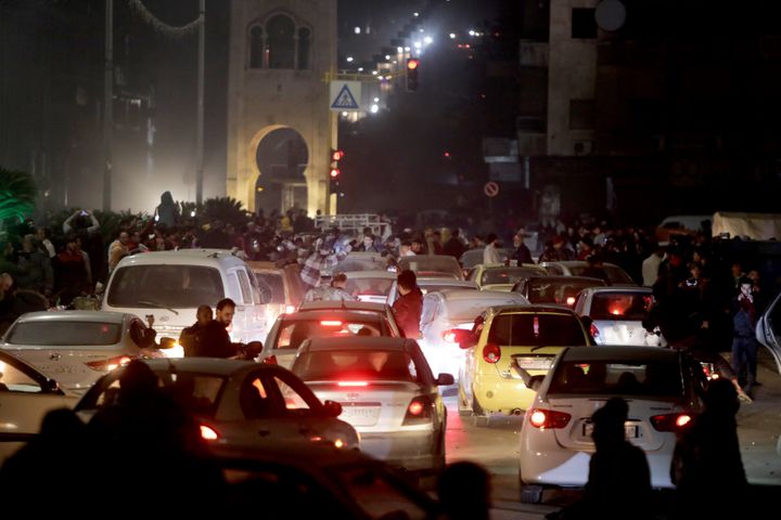 HAMA, SYRIA - DECEMBER 5: People gather in the city center, celebrating the anti-regime armed groups, opposing the Bashar al-Assad regime taking control of the city center of Hama, Syria on December 5, 2024. (Photo by Bekir Kasim/Anadolu via Getty Images)