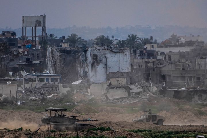 Israeli soldiers operate inside the Gaza Strip, as seen from southern Israel, Feb. 13, 2024.