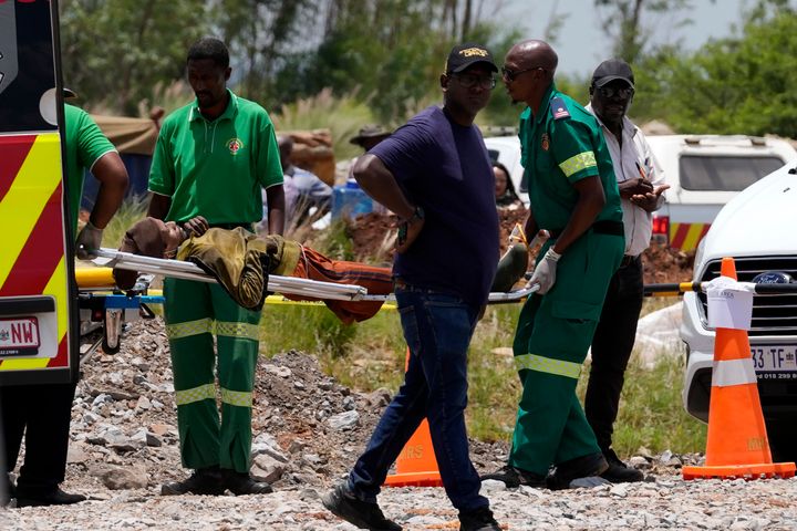 A miner is transported on a stretcher by rescue workers after he was rescued from below ground on Tuesday.