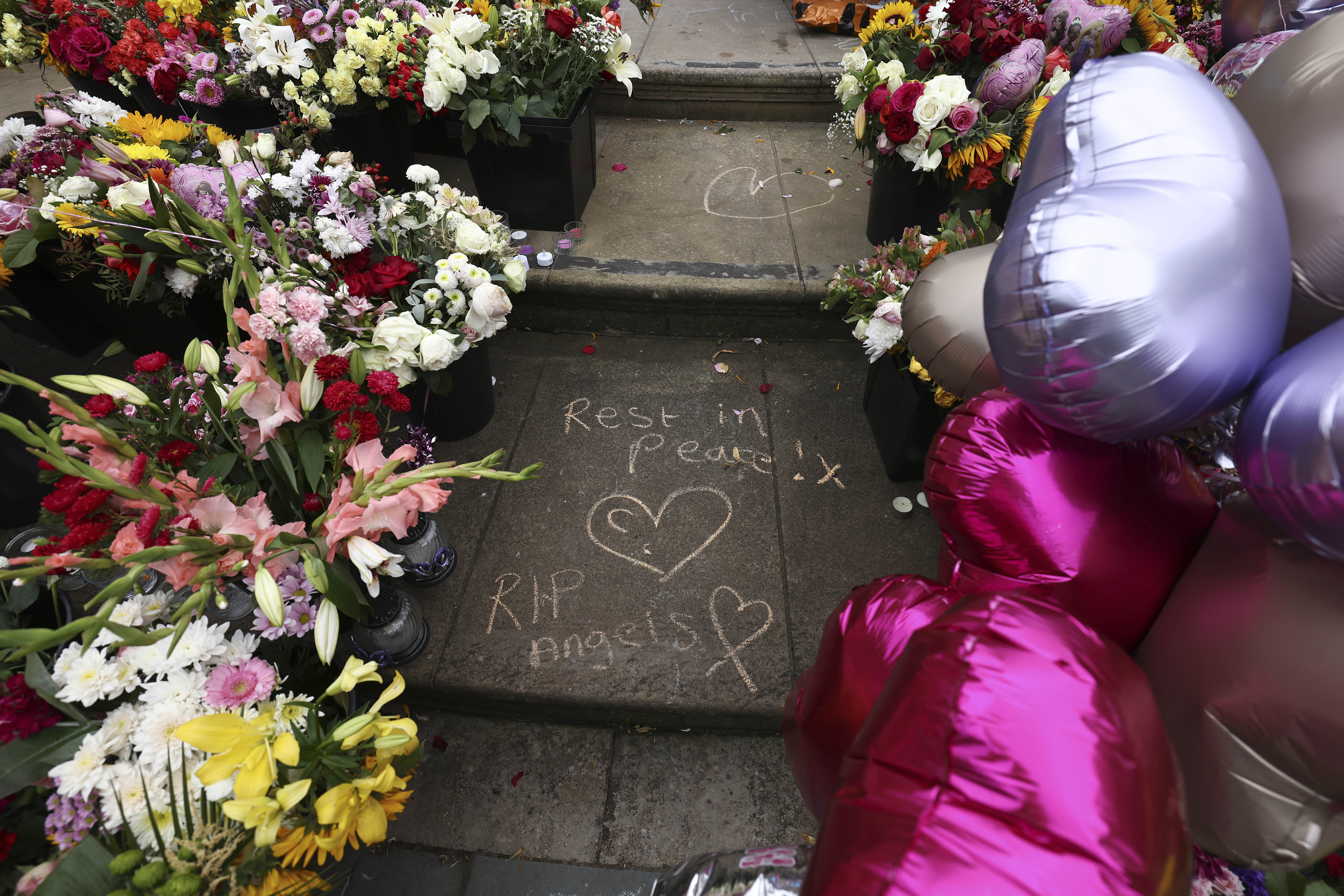 Tributes are seen outside the Town Hall in Southport, England, Aug. 5, 2024 after three young girls were killed in a knife attack at a Taylor Swift-themed holiday club the week before.