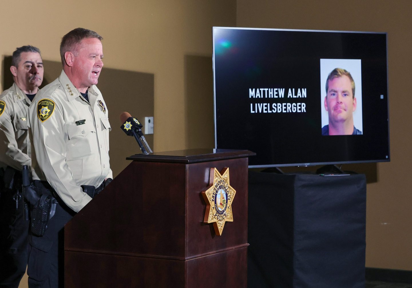 : An image of Matthew Alan Livelsberger driver’s license photo is displayed on a monitor as Las Vegas Metropolitan Police Department Sheriff Kevin McMahill speaks about the Tesla Cybertruck that exploded on New Year's Day