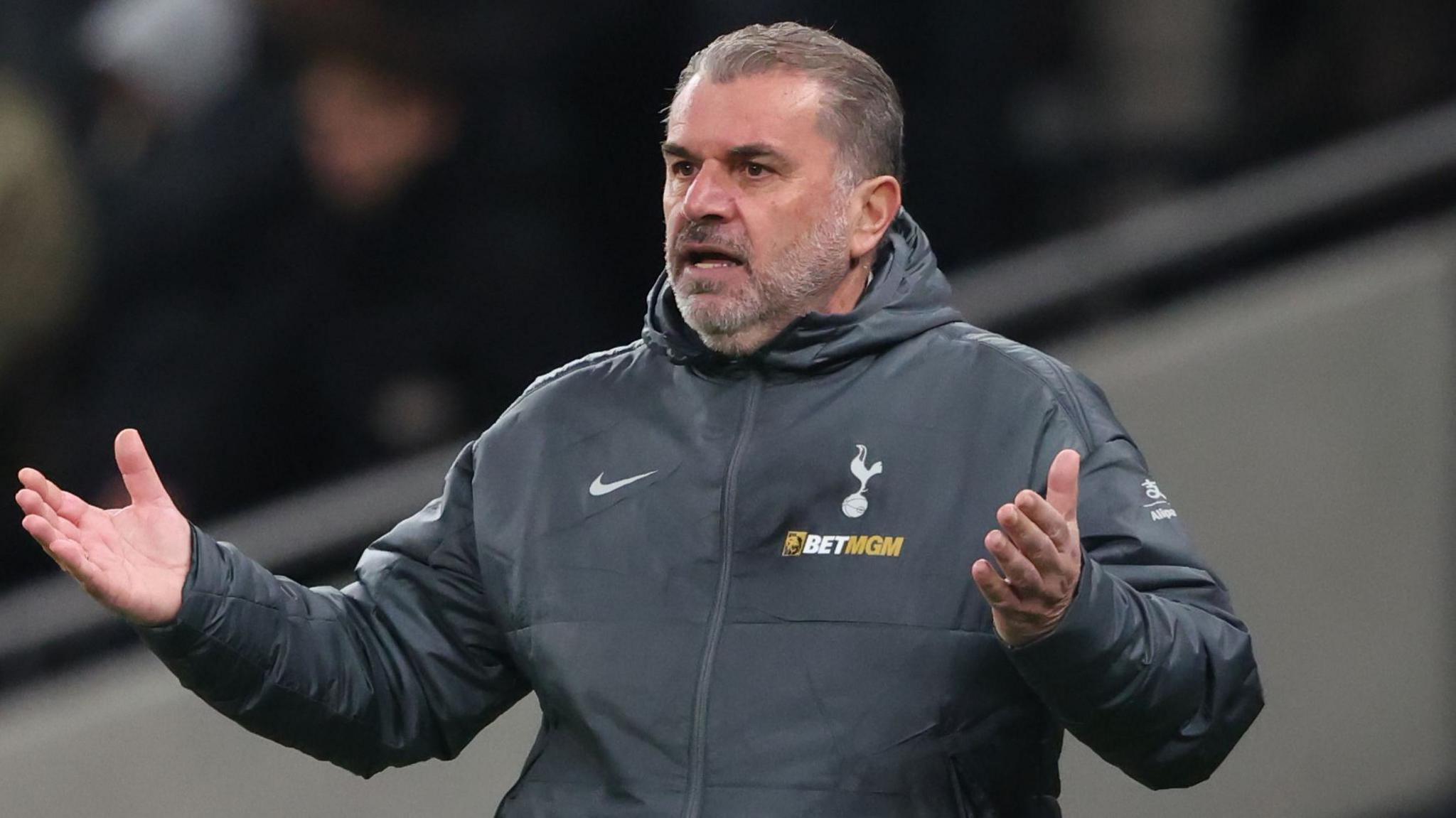 Tottenham boss Ange Postecoglou holds his hands out in exasperation 