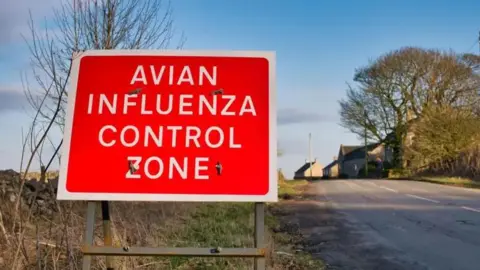 Getty Images Bird flu control zone sign in rural location