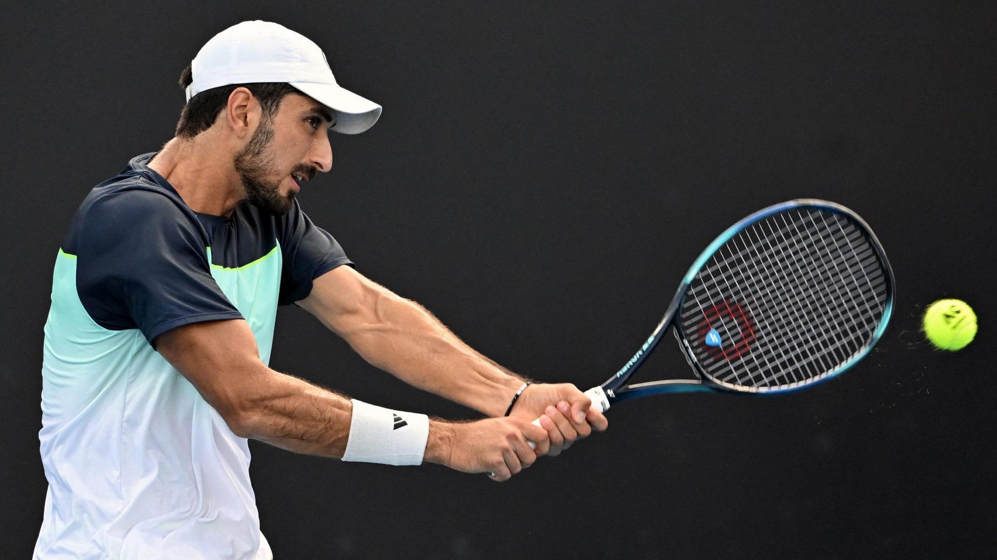 Hady Habib plays a shot at the Australian Open