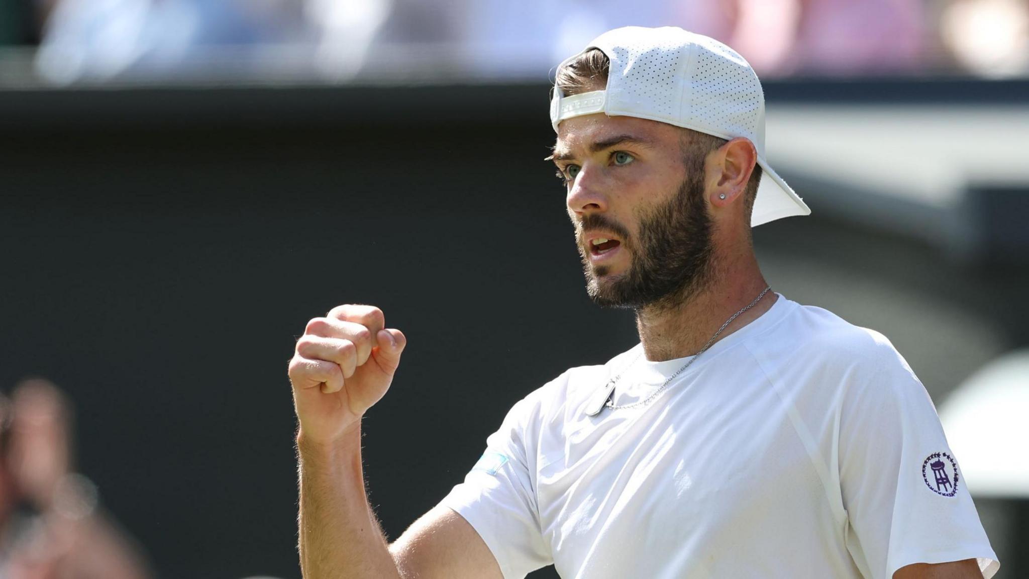 Jacob Fearnley clenches his fist in celebration