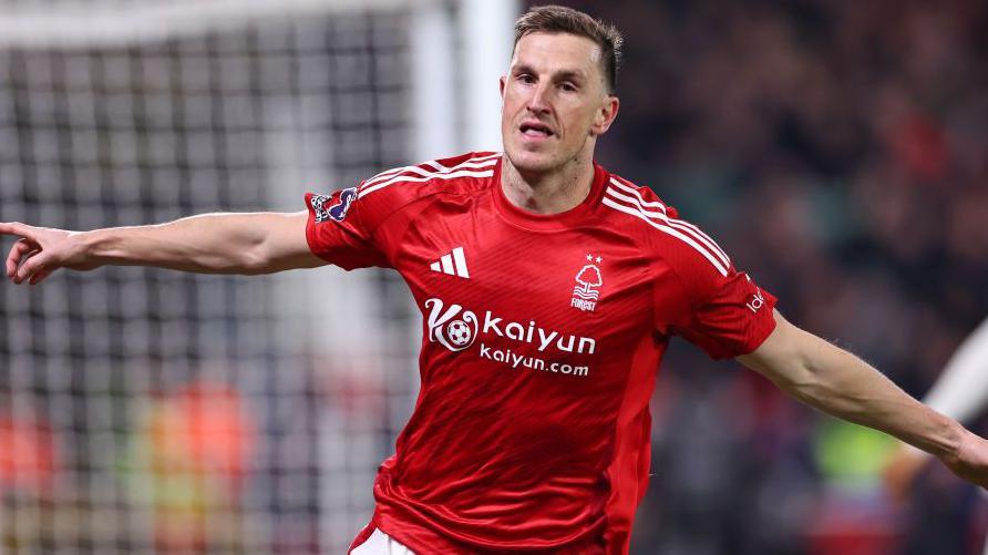 Chris Wood wheels away in celebration after putting Nottingham Forest ahead against Liverpool at The City Ground