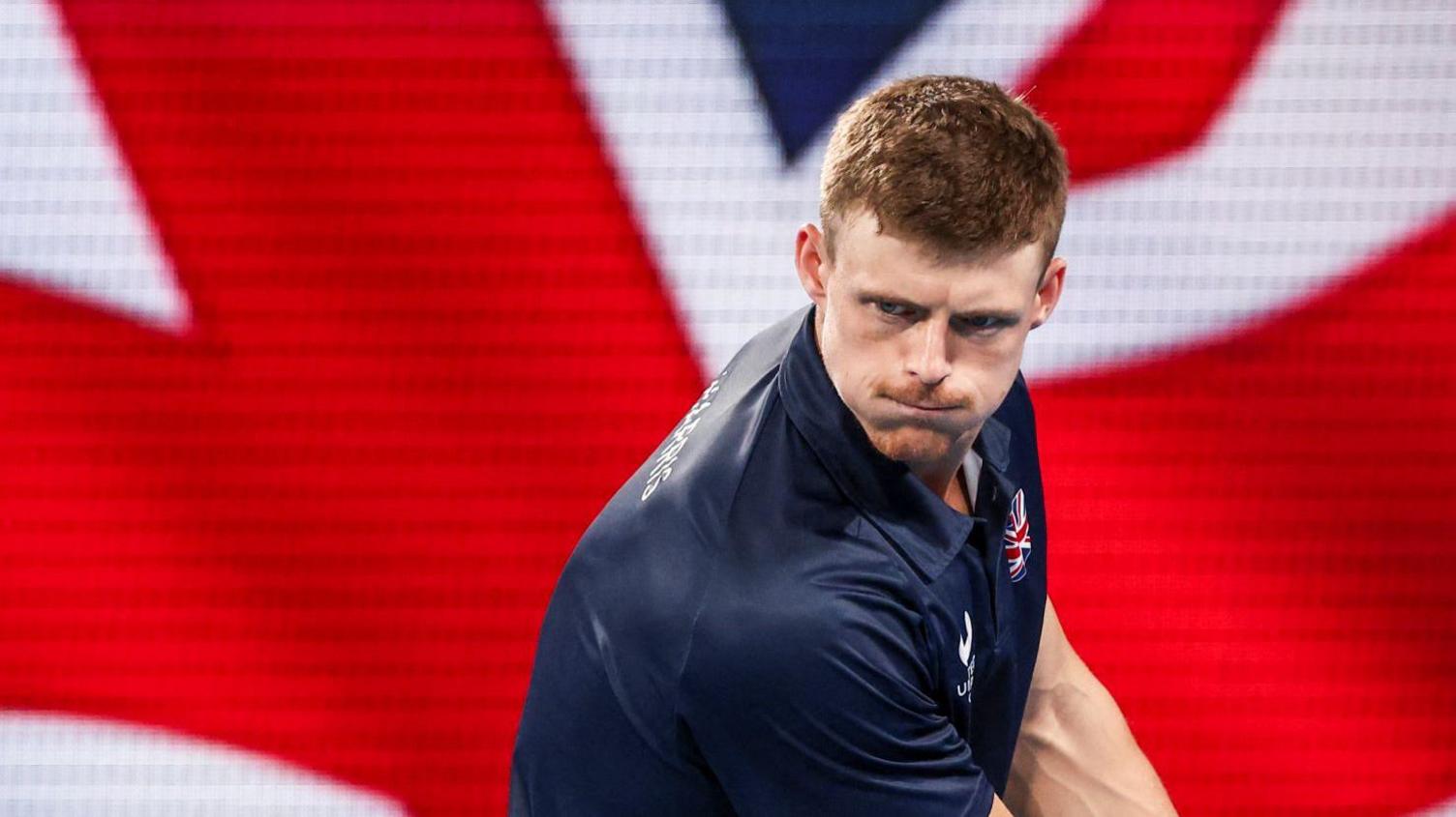 Billy Harris hits a backhand return during Great Britain's United Cup tie against Poland