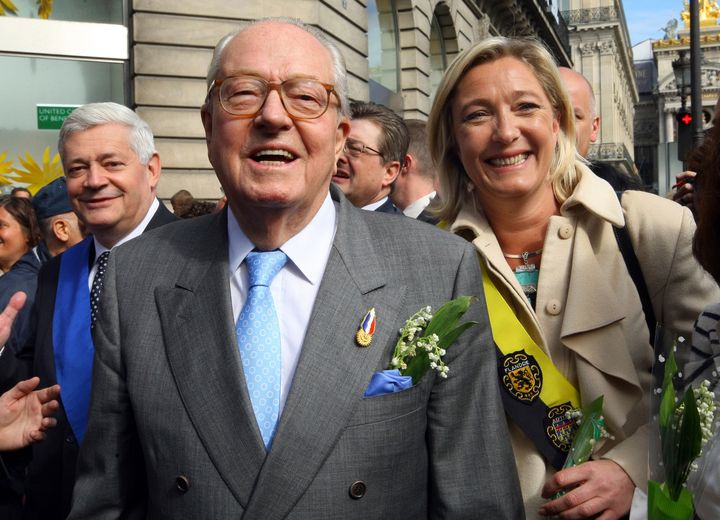 French far-right leader Jean-Marie Le Pen, center, flanked by his daughter Marine Le Pen, and Bruno Gollnisch, arrive for a wreath-laying ceremony at the statue of Joan of Arc, within the party's traditional May Day march on May 1, 2010, in Paris.