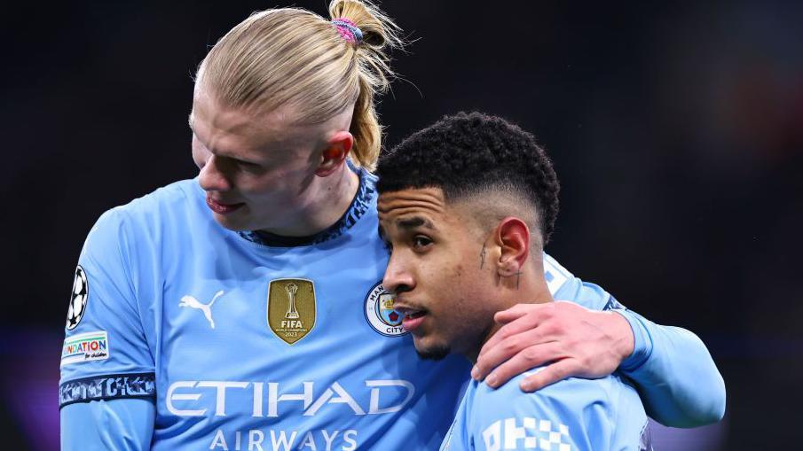 Erling Haaland congratulates Savinho after his goal helped Manchester City to victory over Club Brugge in the Champions League