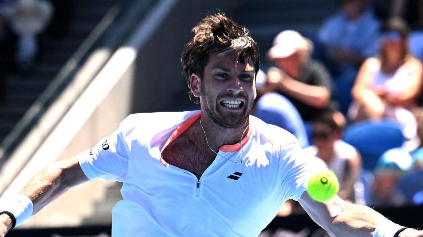 Cameron Norrie stretches for a forehand ball in his 2025 Australian Open defeat by Matteo Berrettini