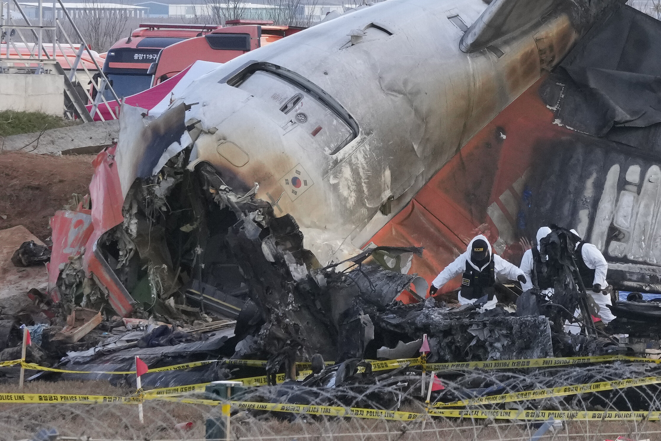 Rescue team members work at the site of a plane crash at Muan International Airport in Muan, South Korea, on Dec. 31, 2024.