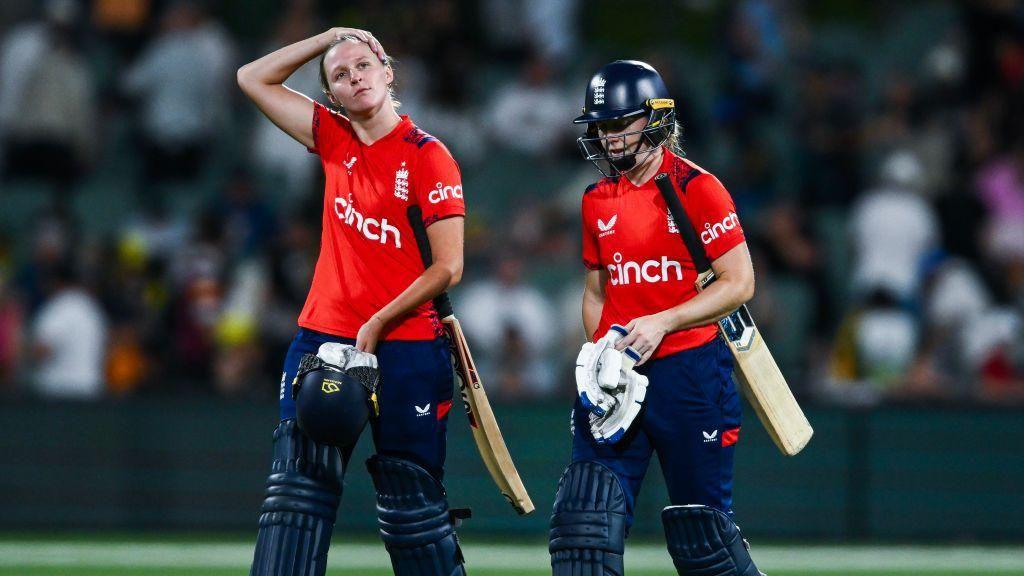 England's Lauren Filer and Heather Knight look dejected after losing the third T20 v Australia