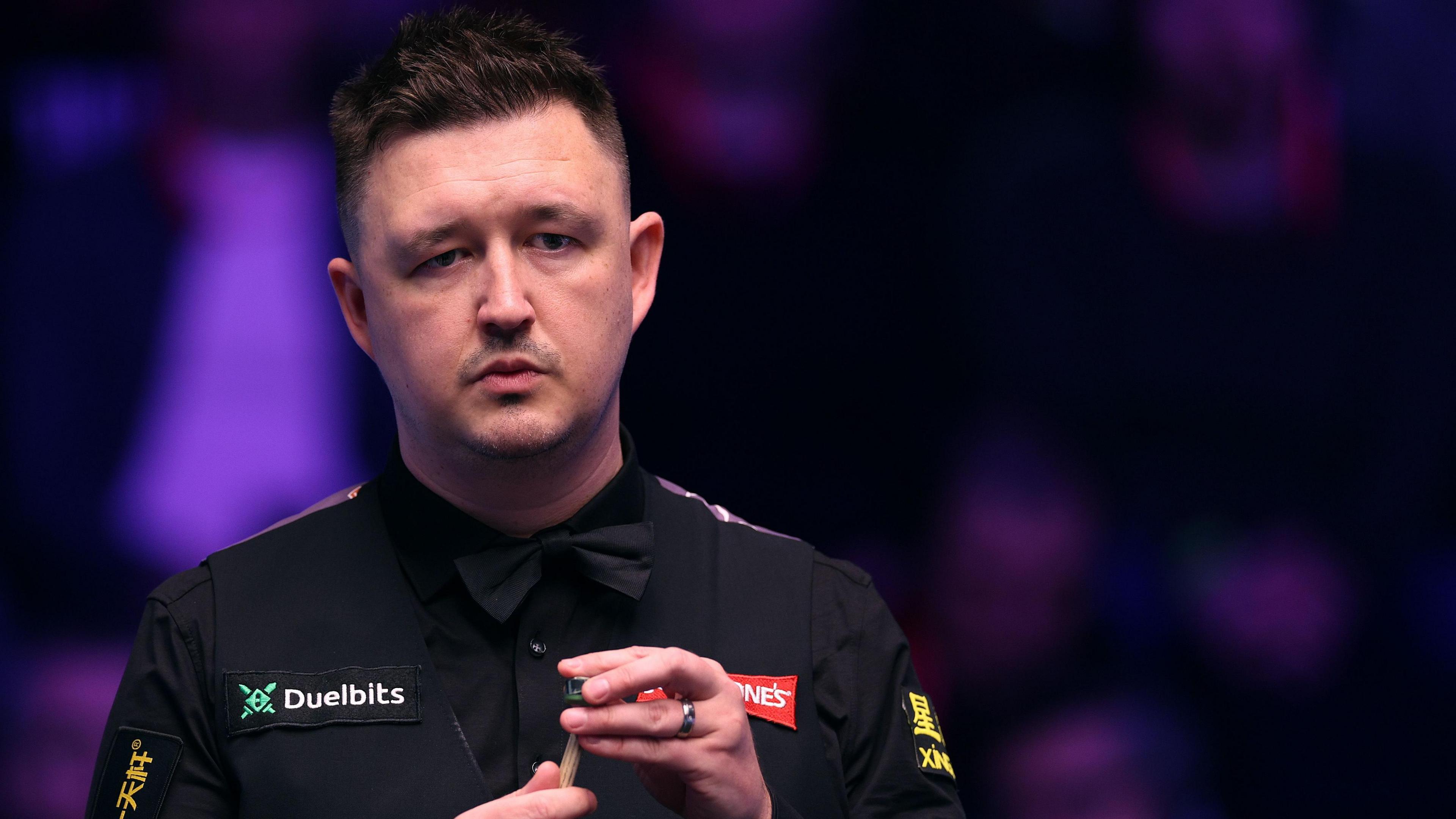 Kyren Wilson chalks his cue