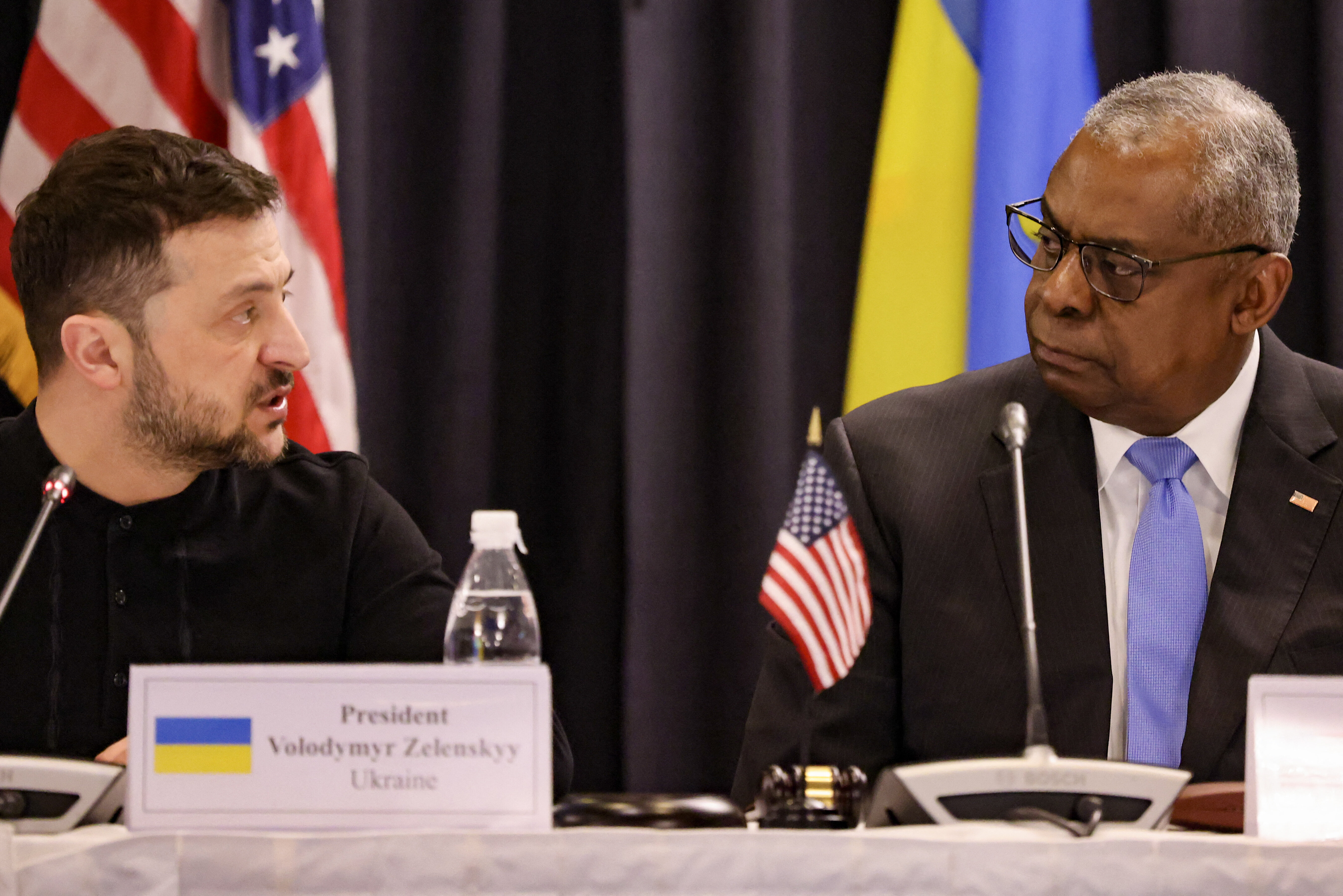 Ukraine's President Volodymyr Zelensky, left, and U.S. Secretary of Defence Lloyd Austin react during the opening of the Ukraine Defense Contact Group meeting at Ramstein Air Base, Germany, on Jan. 9, 2025.