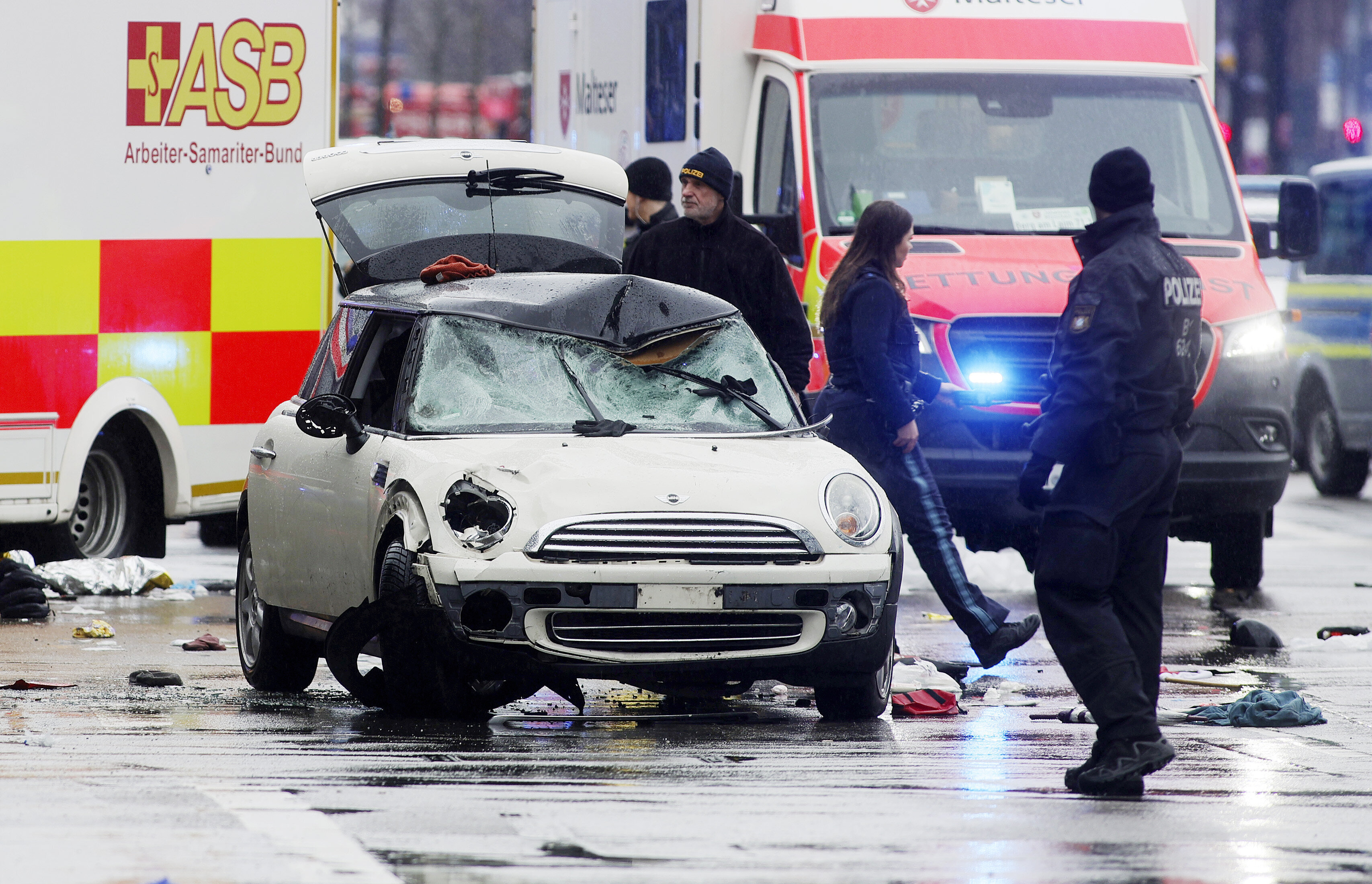 Police and emergency services stand near a damaged car that apparently drove into demonstrators marching in the city center on February 13, 2025 in Munich, Germany. (Photo by Johannes Simon/Getty Images)