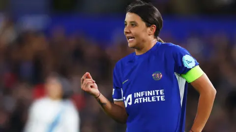 Action Images/Reuters Ms Kerr wearing Chelsea football kit, looking intense.