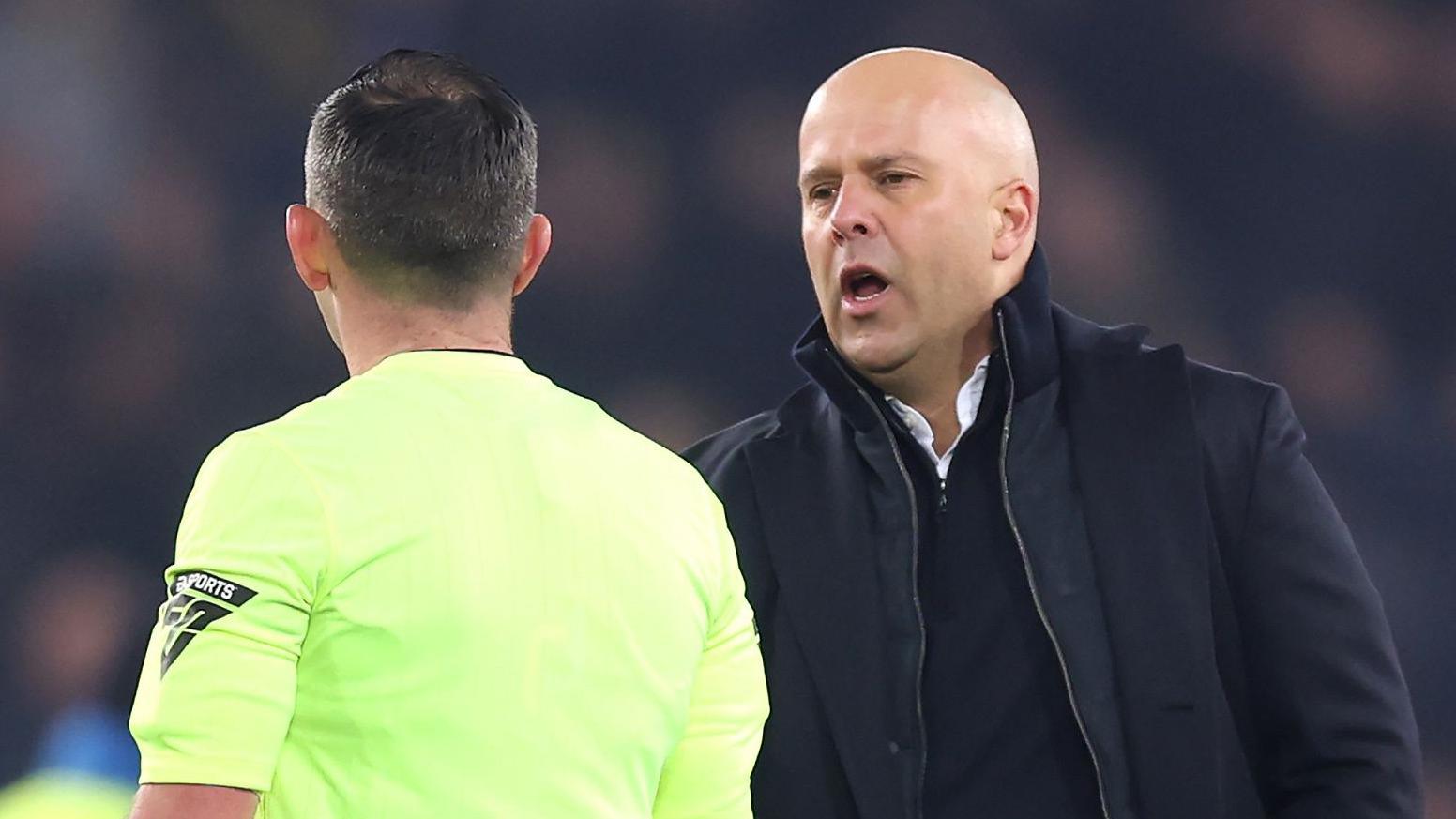 Liverpool manager Arne Slot shakes hands with referee Michael Oliver after the Merseyside derby